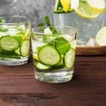 Top 8 Summer Vegetables According to Ayurveda to Stay Cool🌿 Detox drink with cucumber, lemon and mint in glasses on a wooden background